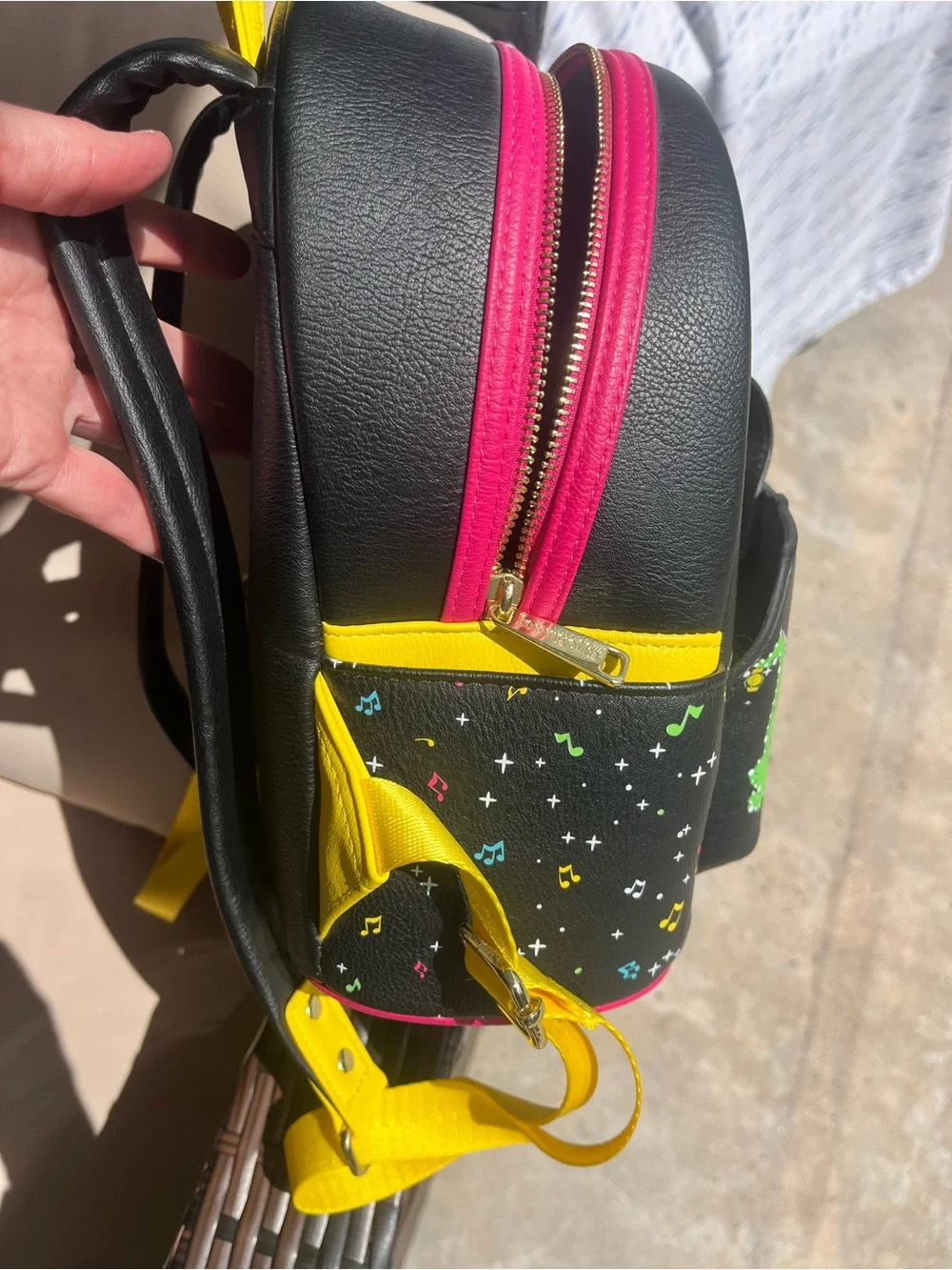 Disney Black Mini Backpack with Yellow Straps and Colorful Mickey Fantasy Print